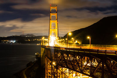 Illuminated golden gate bridge over san francisco bay at night