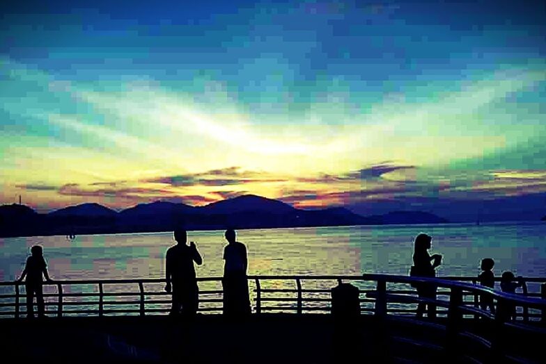 water, silhouette, sky, sunset, scenics, sea, railing, men, mountain, lifestyles, tranquil scene, leisure activity, beauty in nature, tranquility, cloud - sky, nature, person, medium group of people