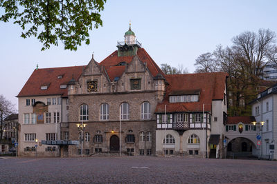 Exterior of buildings in city against sky