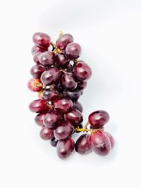 Close-up of grapes against white background