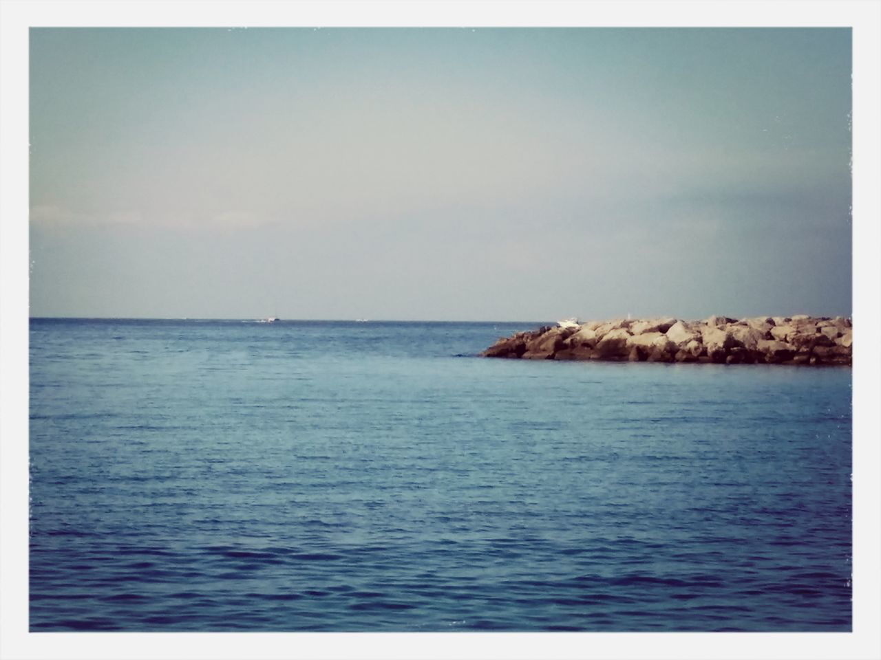 sea, water, horizon over water, transfer print, tranquil scene, scenics, tranquility, beauty in nature, waterfront, auto post production filter, nature, sky, blue, seascape, idyllic, rippled, ocean, no people, outdoors, rock formation