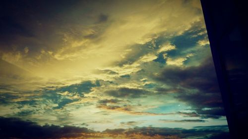 Low angle view of dramatic sky during sunset