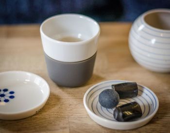 Close-up of cup and coffee on table