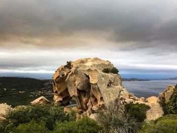 Rock formations on landscape against sky