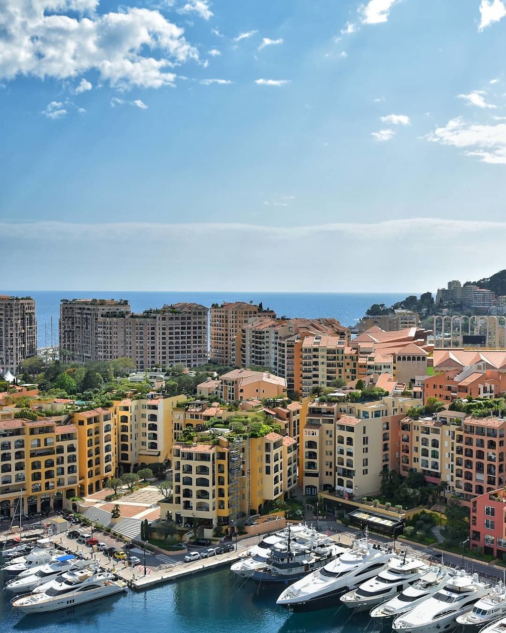 HIGH ANGLE VIEW OF BUILDINGS AND CITY AGAINST SKY