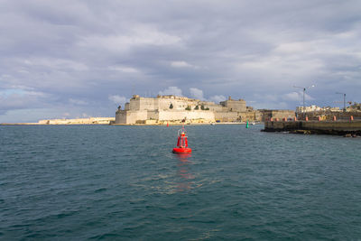 Boat in sea against sky