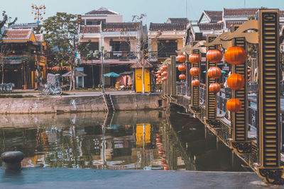 View of bridge over river against buildings