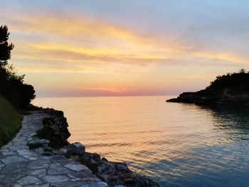 Scenic view of sea against sky during sunset