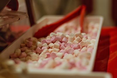 Close-up of marshmallows for sale in tray at market stall