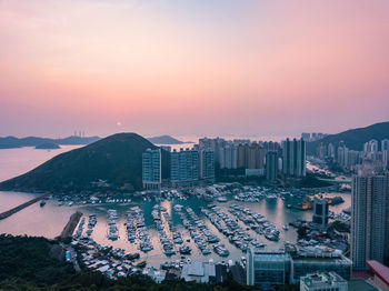 High angle view of city at sunset