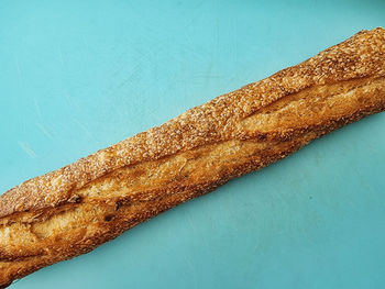 High angle view of bread on table against blue background