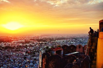 Cityscape against sky during sunset