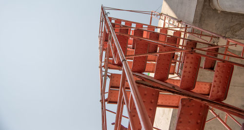 Low angle view of ladder against clear sky