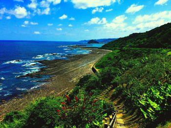 Scenic view of sea against blue sky