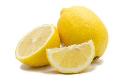 Close-up of oranges against white background