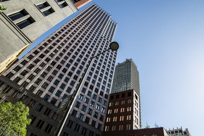 Low angle view of skyscrapers against sky