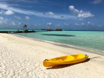 Scenic view of beach against blue sky