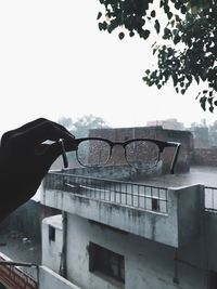 Close-up of hand holding window