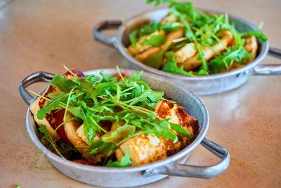 High angle view of salad in bowls on table