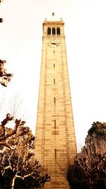 Low angle view of clock tower against clear sky