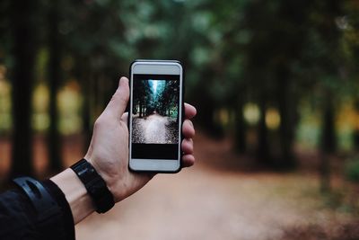 Close-up of hand holding smart phone