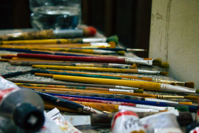 Close-up of paintbrushes on table