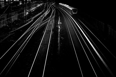 High angle view of railroad tracks at night