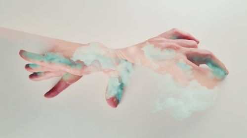 Close-up of human hand against white background