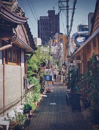 Street amidst buildings against sky