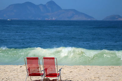 Copacabana beach and sugar loaf mountain in distance by night, rio de janeiro, brazil