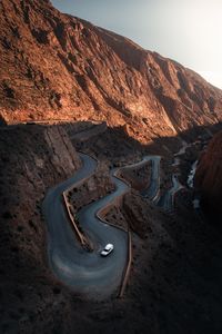 High angle view of road amidst mountains against sky