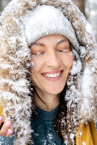 Portrait of a smiling woman in snow