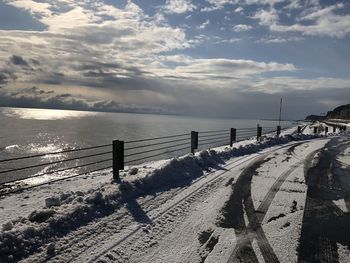 Scenic view of sea against sky during winter