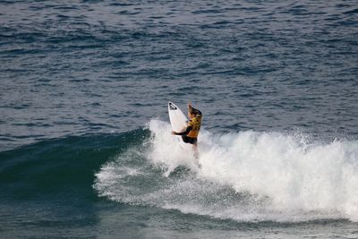 Person surfing in sea