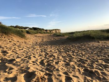 Scenic view of beach against clear sky