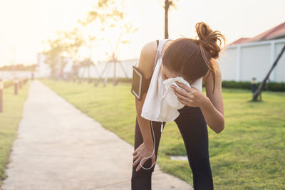 Rear view of woman standing outdoors