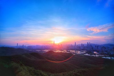 High angle view of city at sunset