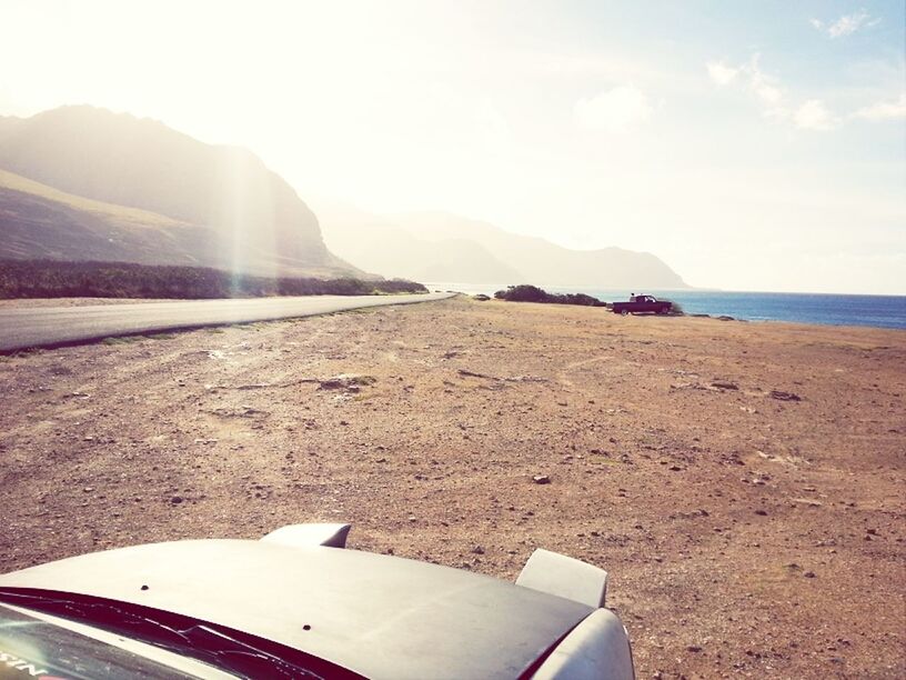 sea, water, transportation, sky, part of, mode of transport, scenics, beach, cropped, beauty in nature, horizon over water, tranquil scene, nature, mountain, tranquility, shore, sunlight, sand, day, travel