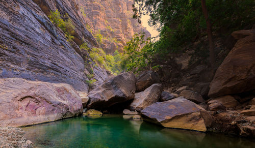 View of pond in front of mountain