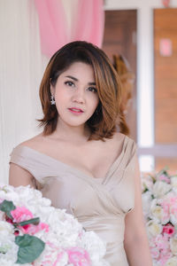 Portrait of a beautiful young woman at home