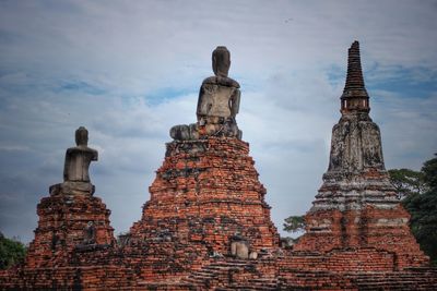 View of old temple against building