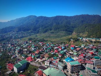 High angle view of city against mountains