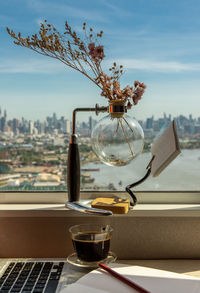 Close-up of coffee on table against window