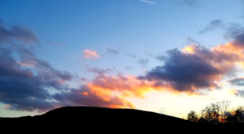 Low angle view of silhouette mountain against sky during sunset