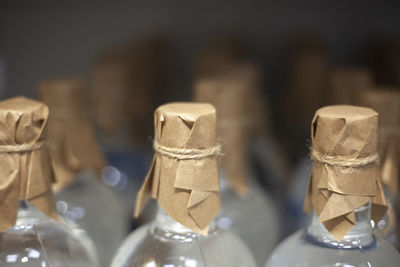 Bottles stand in a row in a store. alcoholic picti on the counter. transparent vessels with vodka. 