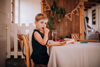 Boy looking at sitting at home