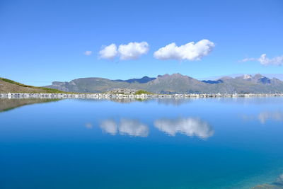 Scenic view of lake against blue sky