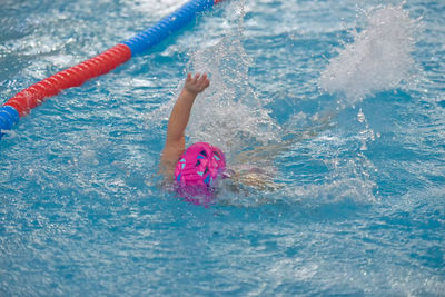 Girl swimming in pool