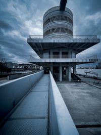 Modern building against cloudy sky