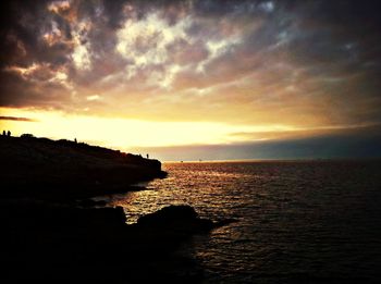 Scenic view of sea against cloudy sky